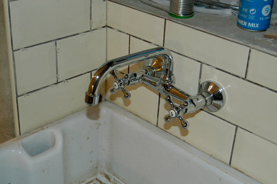 Wall mounted kitchen sink taps  tiled